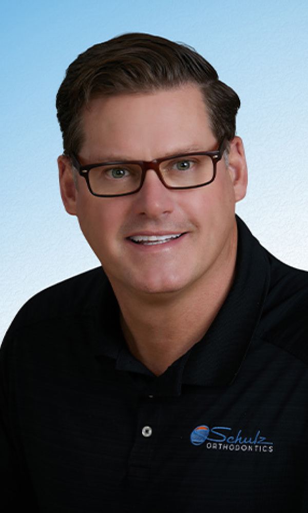 Meet Dr. Schulz – Experienced Orthodontist in Traverse City & Charlevoix. Dr Scott Schulz is smiling