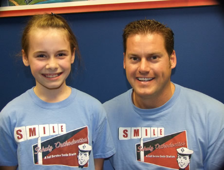 Happy patient smiling with a dentist