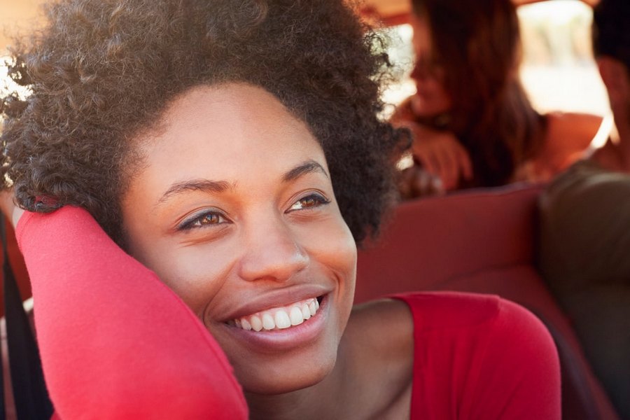 What Doesn’t Qualify for Rewards. A woman is joyfully smiling in the car