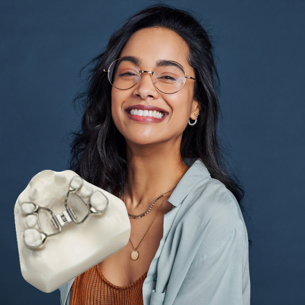 Unlock the Potential of Your Smile with Palatal Expander. A woman is joyfully smiling