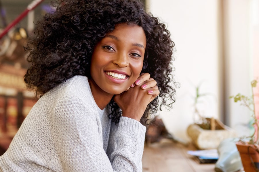 Get the Facts on This Life-Changing Procedure. A woman is smiling after surgery